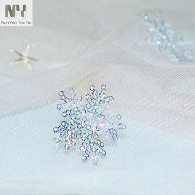 China Nanyee Fluorescent Textile Color Nude Sequin On Mesh Snowflake Embroidery Fabric for sale