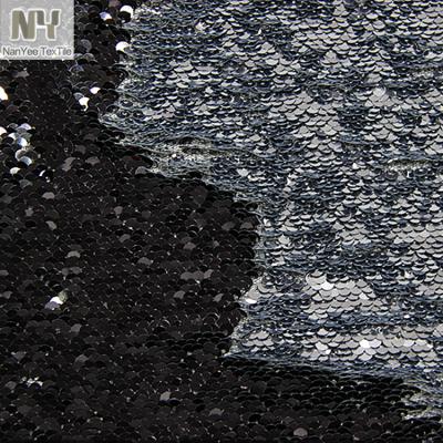 China Nanyee Fluorescent Textile 5mm Custom Colors Black Silver Sequin Reversible Fabric for sale