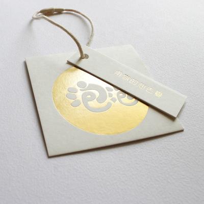 China Viable High Quality Garment Products Accessories Hang Tag For Clothing Swing Custom Labels for sale