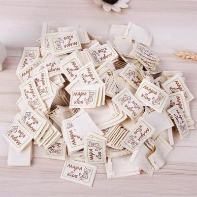 China Washable 100% Organic Cotton Custom Folded Clothing Sewing Labels Tags Printing for sale