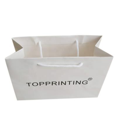 China Custom Handmade Logo Printed Luxury Shopping Gift Paper Bag for sale