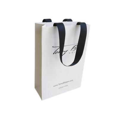 China Luxury Custom Clean Handmade Logo Printed Retail Clothing Packaging Paper Bag Shopping Paper Bag For Clothes for sale