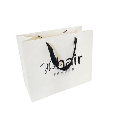 China Handmade Eco Friendly Foldable Gift Bag Printed Paper Shopping Bag With Own Logo for sale