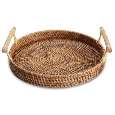 China Sustainable Rattan Woven Round Basket, Round Rattan Woven Serving Tray with Handles for Breadfruit Vegetables, Restaurant Serving Tray for sale