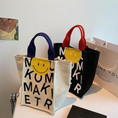 China Shopping Custom Canvas Logo Cute Smile Tote Bag Rope Handle Tote Bag Canvas Men Student Custom Handbags for sale