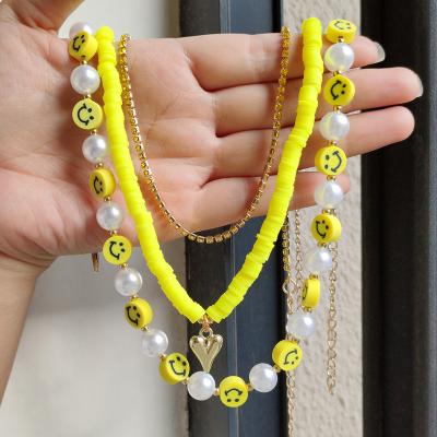 China New Arrival FASHIONABLE Clay Natural Pearl Happy Smile Yellow Face Bead Necklace For Women Pointed Heart Necklace for sale