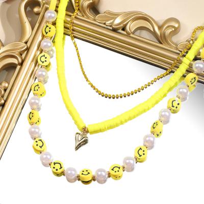 China 2021 TRENDY Heart Choker Pendant Jewelry Gold Plated Boho Handmade Multilayer Pearl Beaded Smiley Clay Necklace For Women Girls for sale