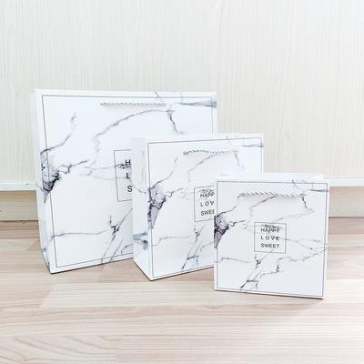 China Recyclable Custom Paper Box With Your Own Logo Ivory Board Paper Gift Suitcase For Birthday Wedding Marble Pattern Cosmetic Bag With Handle for sale