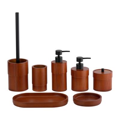 China Accesorios de escritorio de baño de color marrón OAK conjunto de forma redonda bomba negra accesorios de baño dispensador de jabón en venta