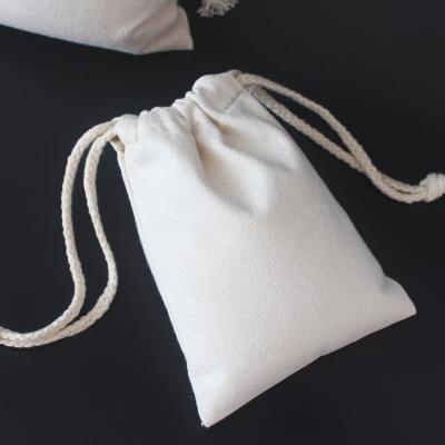 China Custom Organic Eco Friendly Reusable White Logo Cotton Muslin Drawstring Bags 100% Organic Small Drawstring Bags for sale