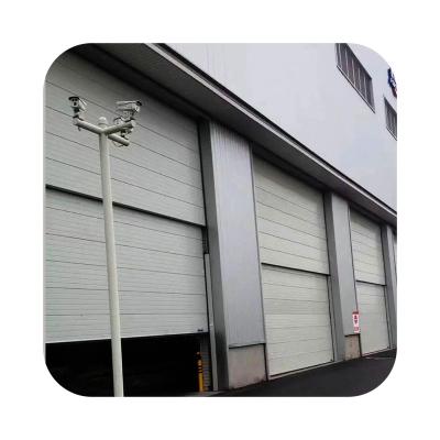 China Windproof Sectional Overhead Vertical Lift Industrial Cutaway Door for sale