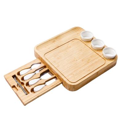 China Sustainable Cheese Board with Knives Set Chopper Bamboo Cutting Board Includes 3 Ceramic Bowls for sale