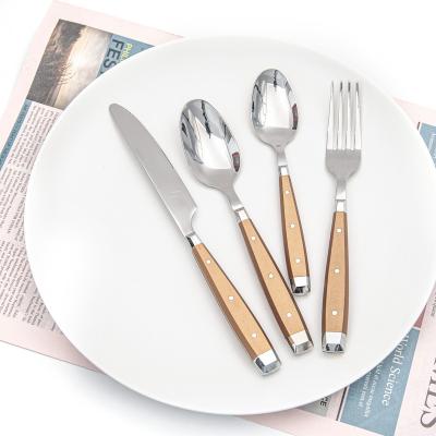 China Viable western high quality design stainless steel plastic handle rivet 24 piece cutlery set supplier manufactures for sale