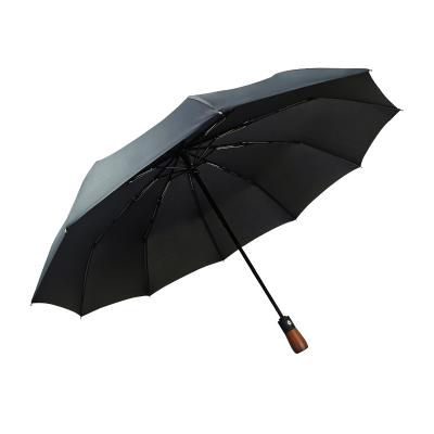 China 23 Inch Super Strong 10 Ribs Windproof Luxury 3 Fold Umbrella with Wooden Handle for sale