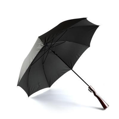 China New design wholesale unique windproof straight gun shaped handle umbrella with sling for sale