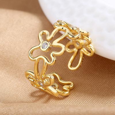 China Women Zircon Flower Opening Ring 18k Gold Plating Flower Nickel Free Lead Free Simple Hollow Hollow Irregular Ring for sale