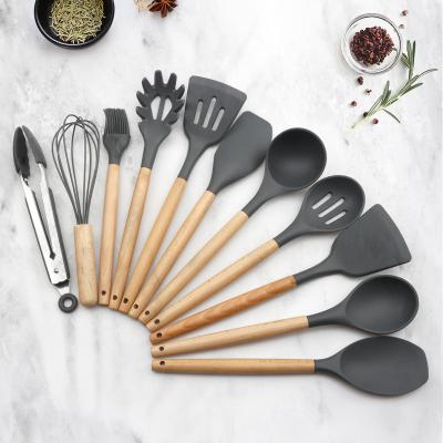 China Viable Wholesale 12 Pieces in 1 Set Silicone Kitchen Cooking Tools Stand Up Kitchen Tableware BBQ Eco Silicone Wooden Kitchen Utensils for sale