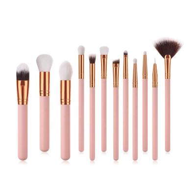 China Angular blush 12 piece pink porcelain makeup brush set al venta de por mayor maquillaje makeup brushes manufacturers for sale