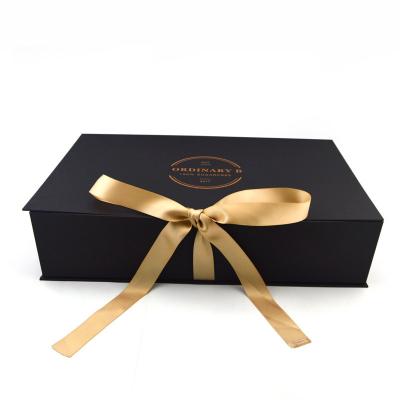 Cina Black Custom Magnetic Premium Luxury Recyclable Cardboard Paper Packaging Clothing Box Flip Top Gift Boxes With Ribbon in vendita