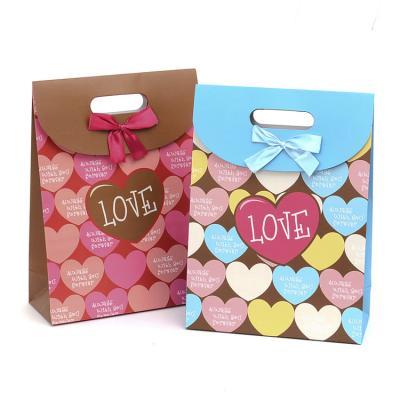 中国 Custom Color Shopping Paper Recycling Bag Recycled Materials With Ribbon 販売のため