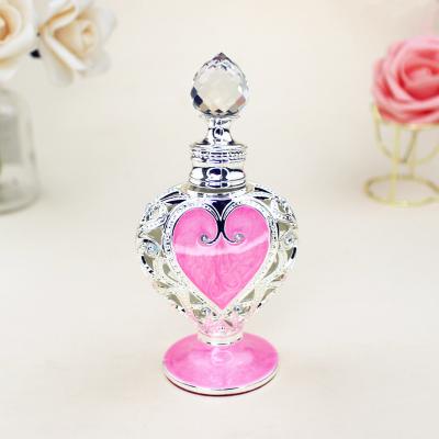 China Customized Design New Elegant Alloy Enamel Pink Heart Shape Cosmetic Glass Perfume Gift Bottle with Glass Top for sale