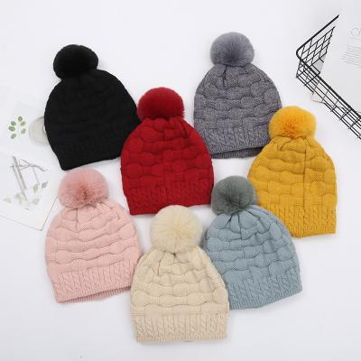 China COMMON Twist INS Solid Color Beanie Hat With Pom Pom Winter Hat High Quality Adult Beanies For Women Females for sale