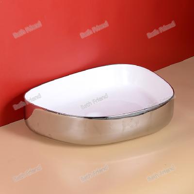 China Modern luxurious wash basin gold electroplating  table top basin ceramic Bano lavabo bathroom sink for sale