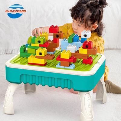 China DIY TOY Preschool Kids Multifunctional Drawing Building Blocks Toys PULL BACK Building Block Plastic Table Set for sale