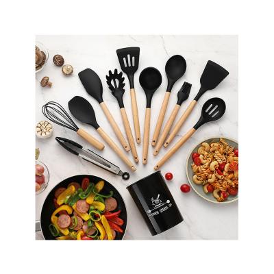 China Sustainable Silicon Kitchen Spatula Spaghetti Serving Slotted Spoon Cooking Tools Serrated Kitchen Utensils With Rack for sale