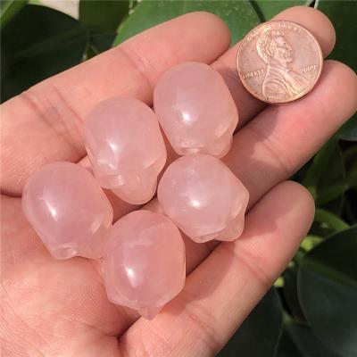 China Europe accept beautiful pink crystal skulls customized natural rose quartz skulls for healing for decoration for sale