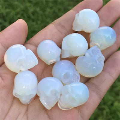 China Europe accept beautiful pink crystal skulls customized natural rose quartz skulls for healing for decoration for sale