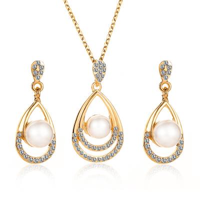 China Fashion Religious Wedding Water Drop Stud Pearl Rhinestone Earrings And Necklace Bridal Jewelry Set For Women for sale