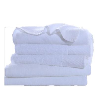 China Compressed Custom Logo 100% Cotton Bath White Hotel Towels 70*140 for sale