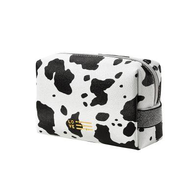 China Fashion Waterproof Custom Makeup Pouch Cute Animal Cow Pattern PU Leather Cosmetic Bag For Women for sale