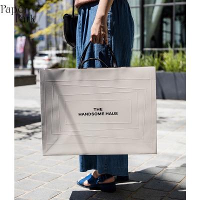 China White Embossing Design Shopping Bags Large Custom Paper Women Clothing Handmade Single Line Shopping Paper Bag for sale