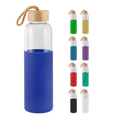 China 600ml 20oz Food Grade Leak Proof Borosilicate Glass Sustainable Water Bottle With Bamboo Lid for sale