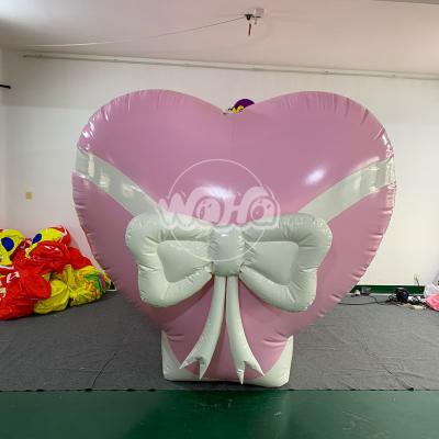 Cina Inflatable Oxford Cloth Pink Heart With White Butterfly Kont For Wedding Decoration in vendita