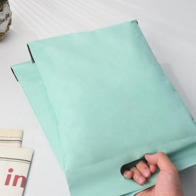 China Eco-friendly Custom Color Logo Printed Courier Shipping Package Postage Parcel Mailing Bags Poly Mailers With Handle For Shipping for sale