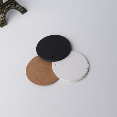 China Small Anti-Counterfeit Circular Tags Black Kraft Paper Hang Tags Mark Garment Tags for sale