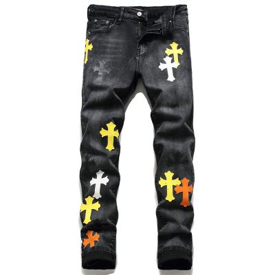 China QUICK DRY Cross Embroidered Skinny Mens Leather Patch Stretch Jeans Mens Jeans for sale