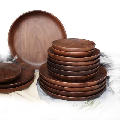 China Black Walnut Fruit Dish Dinner Plate Sustainable Solid Acacia Wood Wooden Dish for sale