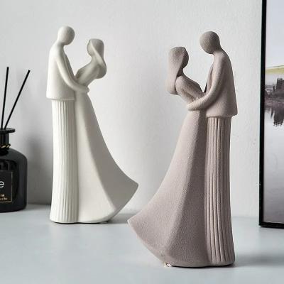 China Ceramic Love Couple Figurines Statue Modern Ornament Living Room Decoration Home Accessories Wedding Gifts for sale