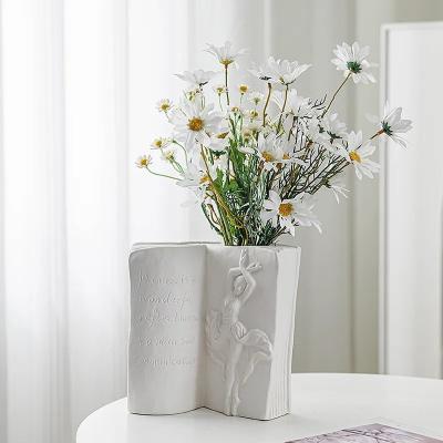 China Nordic Decorative White Vases Modern Ceramic & Porcelain Vases for Home Abstract Human Face Book Shape Ceramic Flower Va for sale