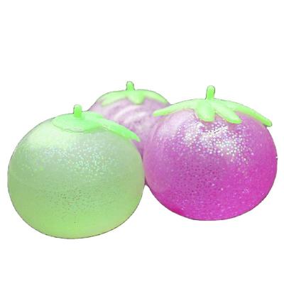 China Interesting Cute TPR Tomato Water Splat Ball Glitter Squeeze Toy For Kids for sale