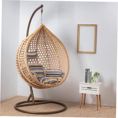 China Durable Egg Hotel Rattan Wicker Hanging Swing Chair With Metal Stand for sale