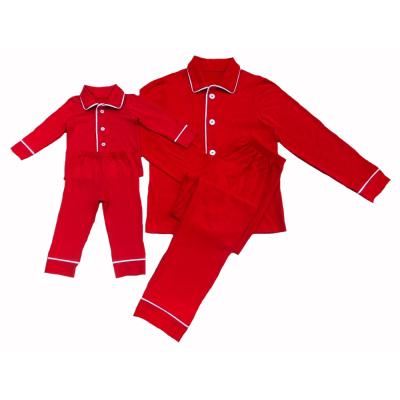 China Eco-Friendly Kids Winter Long Sleeves Solid Red Pajamas Button Up Boys And Girls Christmas Pajamas Sets With Piping for sale