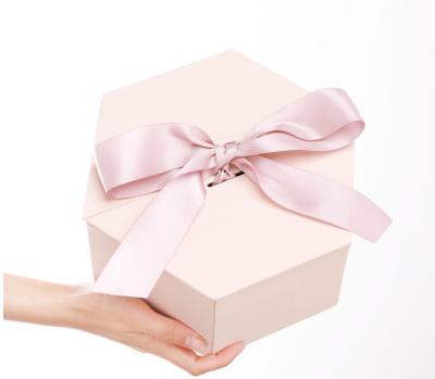 China Custom logo printed gift hexagon shaped packaging paper box with ribbon bow for sale