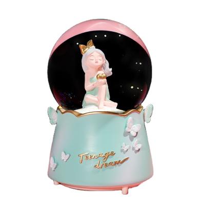 China Crystal Ball Music Box Mini Christmas Girl's Luxury Crystal Ball Light Wholesale Glass Gift for sale