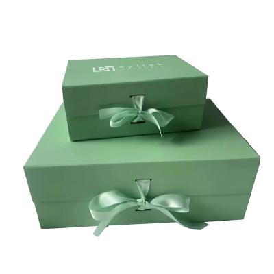 China Recyclable Wholesale Luxury Bespoke Custom Logo Rigid Cardboard Magnetic Paper Gift Folding Boxes With Ribbon Closure For Wedding Dress for sale