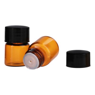 China Small 1ml Amber Mini Glass Bottle Sample Vial Cosmetic Travel Essential Oil Bottle with Orifice Reducer and Black Cap for sale